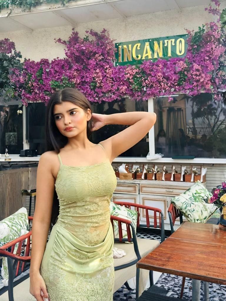 Manasvi Pathak Instagram post, green lace dress café lifestyle content from Agra
